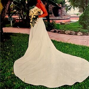 Vintage St. Tropez strapless off white wedding dress with adjustable train.